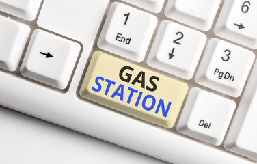 Text sign showing Gas Station. Business photo showcasing for servicing motor vehicles especially with gasoline and oil White pc keyboard with empty note paper above white background key copy space