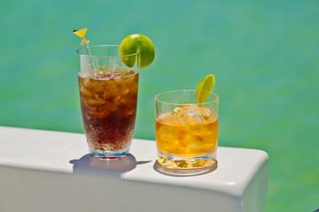 cocktails on board a pleasure boat on the background of the blue Caribbean sea near the shore