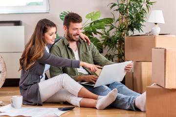 Freshly married husband and wife in their new apartment