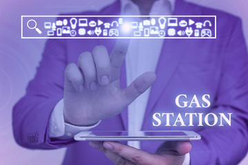 Word writing text Gas Station. Business photo showcasing for servicing motor vehicles especially with gasoline and oil Male human wear formal work suit presenting presentation using smart device