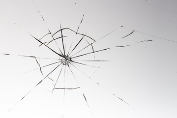 Cracked glass on a white background texture
