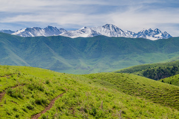 Pastures of Alamedin valley with a high mountains backdrop, Kyrgyzstan