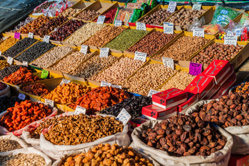 BISHKEK, KYRGYZSTAN - MAY 19, 2017: Dried fruits and nuts at the Osh bazaar in Bishkek, capital of...