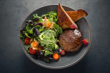 Burger salad. Meat dish of juicy beef patties, lettuce, vegetables, toast.