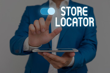 Word writing text Store Locator. Business photo showcasing to know the address contact number and operating hours Male human wear formal work suit presenting presentation using smart device