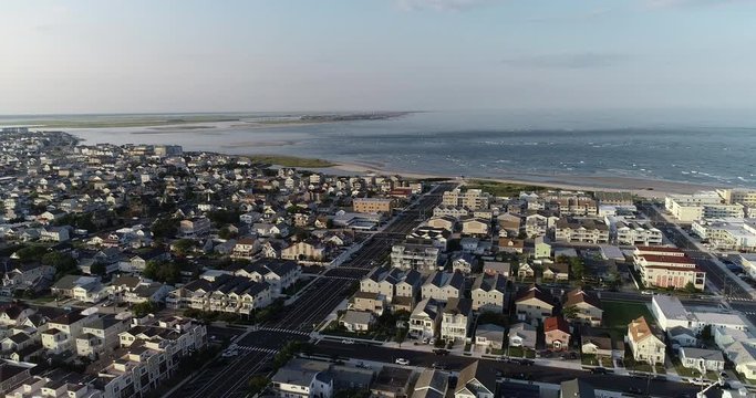 View from aerial drone flying over New Jersey beach town in evening time around sunset Wildwood
