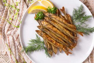 Snack to beer fried crispy small smelt fish. Balkan cuisine. Restaurant menu