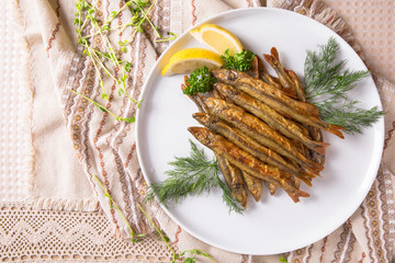 Snack to beer fried crispy small smelt fish. Balkan cuisine. Restaurant menu