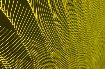 Obraz premium abstract long exposure blurred light lines black and yellow background. Geometric shapes
