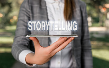 Word writing text Storytelling. Business photo showcasing social and cultural Activity with Theatrical Gestures Outdoor scene with business woman holds lap top with touch screen