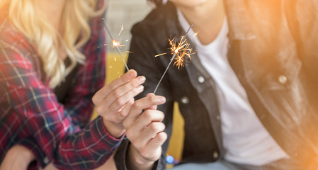 Abstract blur beautiful sparklers Motion by couple man and woman holding burning sparkle for celebration 