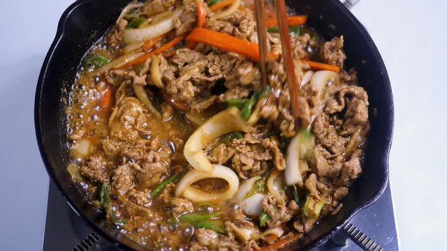 Korean food : Bulgogi is prepared with beef that has been marinated in soy sauce, honey, minced green onion, garlic, sesame seeds, and pepper, and then grilled. 