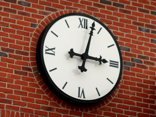 Fototapeta na wymiar clock on brick wall