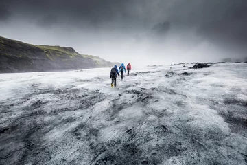 Fototapeten People hike in a glacier © surangaw