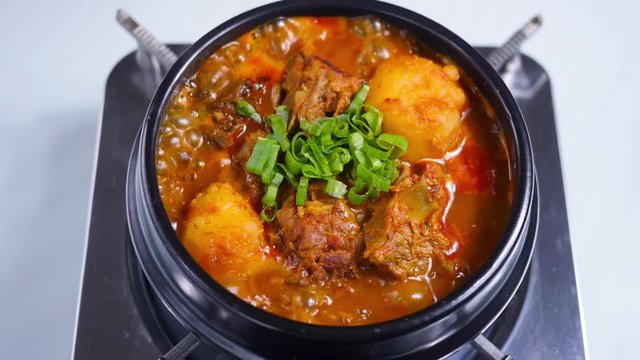 Korean food : Gamjatang. A thick soup made of pig backbones, potato, green cabbage leaves (ugeoji), crushed perilla seeds, perilla leaves, spring onions, and garlic. 