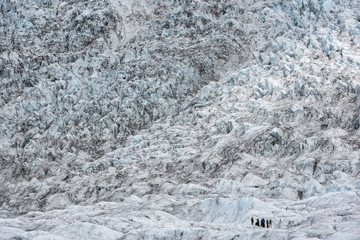 People hike in the glacier