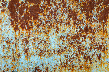 fragment of metal surface painted with blue paint