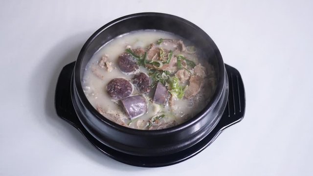 Korean food : Sundaeguk. This dish consists of sundae, which is steamed pig intestines stuffed with seasoned, minced vegetables, and rice with soup.