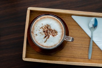 a cup of chocolate milk, a cup of hot chocolate, hot chocolate