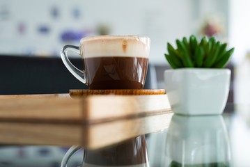 a cup of chocolate milk, a cup of hot chocolate, hot chocolate