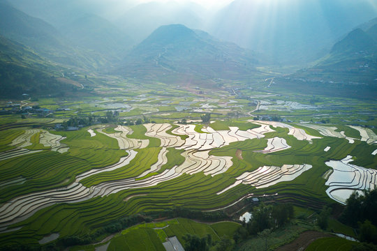 Aerial image of rice terraces in Mu Cang Chai, Vietnam in watering season.