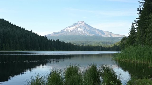 Large wide zoom out eye level shot of Trillium lake with a view over Mt Hood