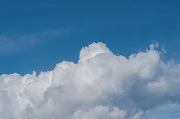 the clouds are white in the summer blue sky