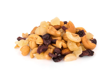 pile of mixed nuts and dried fruits isolated on white background, food for health