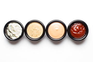 Obraz na płótnie Canvas different sauces in assortment in black sauces