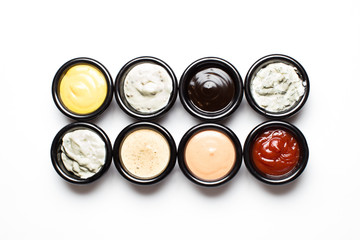 different sauces in assortment in black sauces