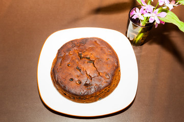 Plum cake on a white plate