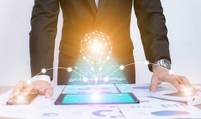 Businessman using concept tablet data graph analysis With modern technology