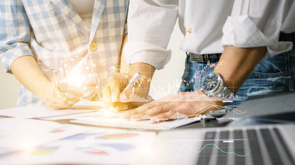 Business team work analyzing charts network technology world the desk notebook on wood table Idea presentation.
