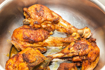 Closeup of Indian style Fried Chicken in steel bowl