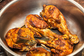 Closeup of Indian style Fried Chicken in steel bowl