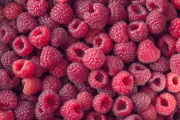 background with ripe raspberries. raspberries flat lay.  texture of raspberries.