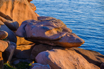 The incredible Pink Granite Shore near the village of Plumanach at sunrise.The coast of Pink Granite is a unique place in Brittany. France