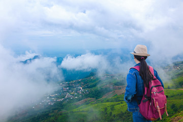Fototapeta na wymiar Travelers looking at Phu Tub Berk mountain with mist, Thailand