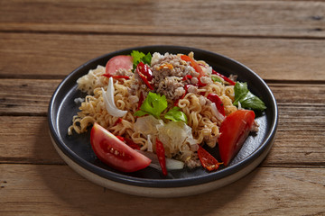 Spicy mama salad with pork on wood table,Spicy noodle.