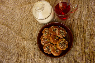 homemade honey cookies with seeds on a plate. tea time. Sweet treat for the holiday. Place under the inscription
