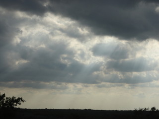 Obraz na płótnie Canvas storm clouds with sun rays