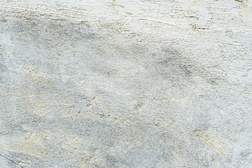 Texture of a concrete wall with cracks and scratches which can be used as a background