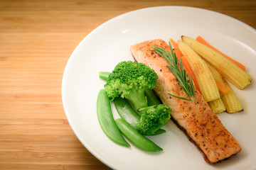 Homemade Grilled Salmon Steak and Vegetables Toping with Salmon Crispy Skin