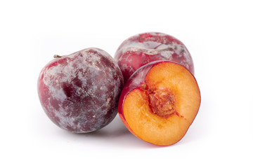 ripe red plum on white background