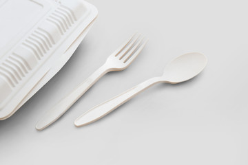 Biodegradable plastic lunch box, spoon and fork on white background isolate with clipping path