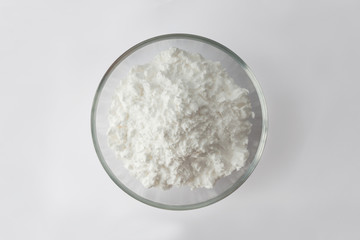 Top view tapioca starch powder in wooden bowl background isolate