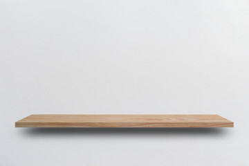 Front view empty wooden shelf and grey wall. Design concept