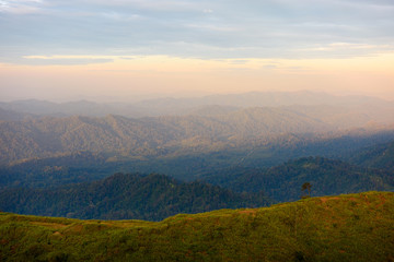 Fototapeta premium Silhouette of Mountain With Fluffy Clouds during Sunrise at Noen Chang Suek, Kanchanaburi, Thailand