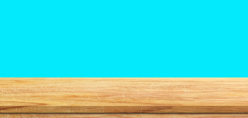Empty wood table or shelf isolated over blue background. For design or product display montage.