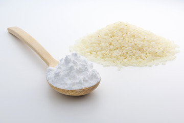Wooden spoon with Japanese rice starch flour, closeup, Short Grain Sushi Koshihikari Rice, High resolution.